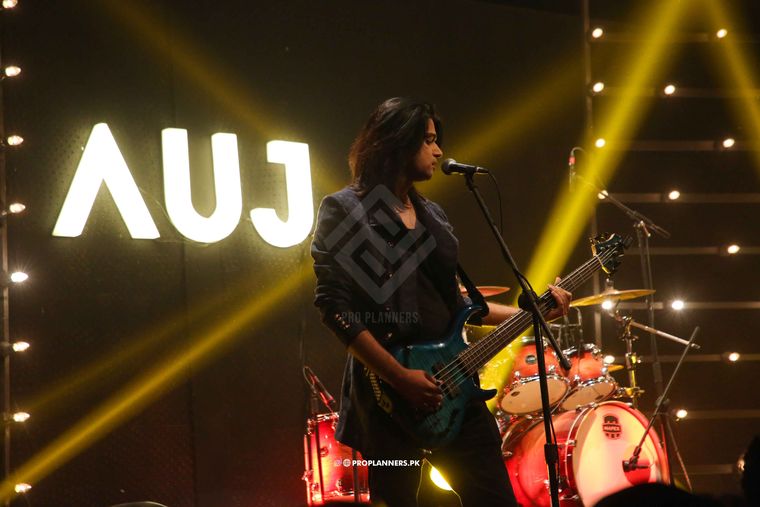 Bass under the AUJ sign
