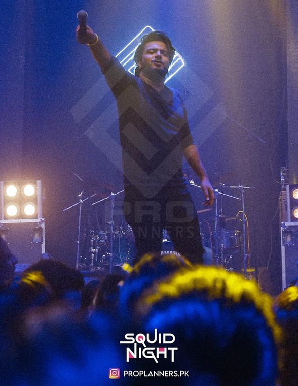 Squid Night, hands up at the barrier